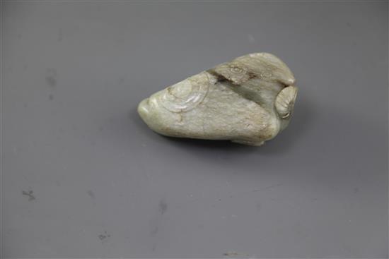 A Chinese pale celadon jade figure of a recumbent buffalo, Ming dynasty, length 11cm